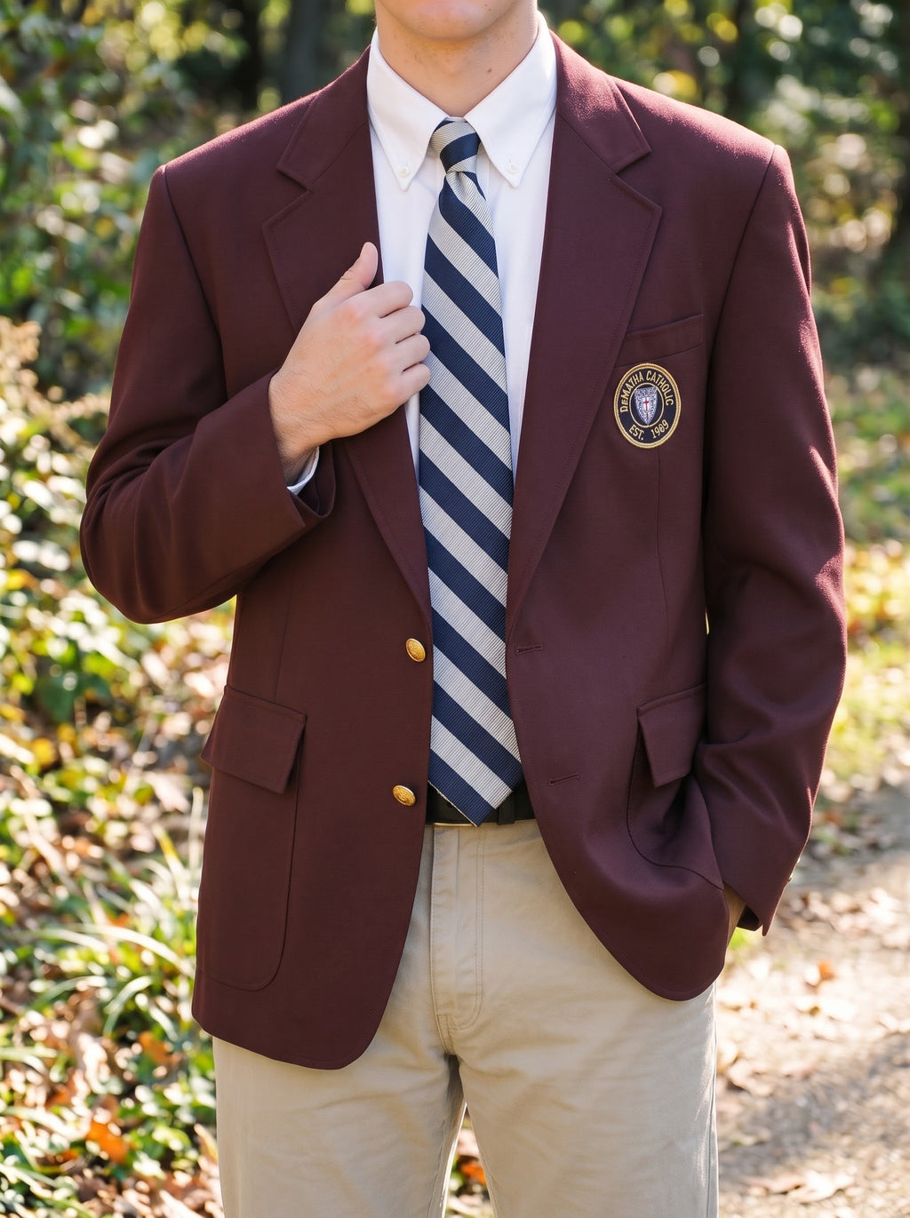 Student wearing the maroon DeMatha blazer with a striped tie