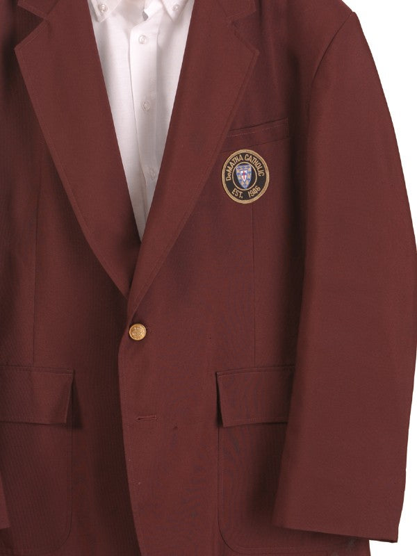 Close-up of the patch on the maroon DeMatha blazer