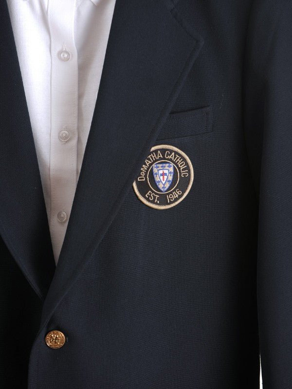 Close-up of the patch on the navy DeMatha blazer