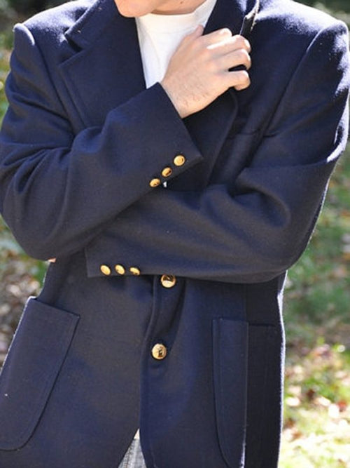 Gold buttons on a navy DeMatha blazer